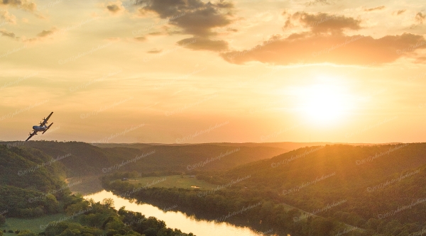 20 C 130 Over The White River At Sunset Near Painters Bluff - Professional New Photography 2023 photography by Paul Caldwell